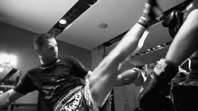 Ali and a training partner working through combinations on the pads